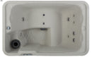 Beige textured hot spring 2 seater portable spa with silver jet nozzles and central control panel for spa guys refurbishment process